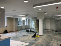 a room that is being remodeled with a glass wall