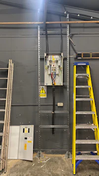 a ladder and a ladder in a room with electrical equipment